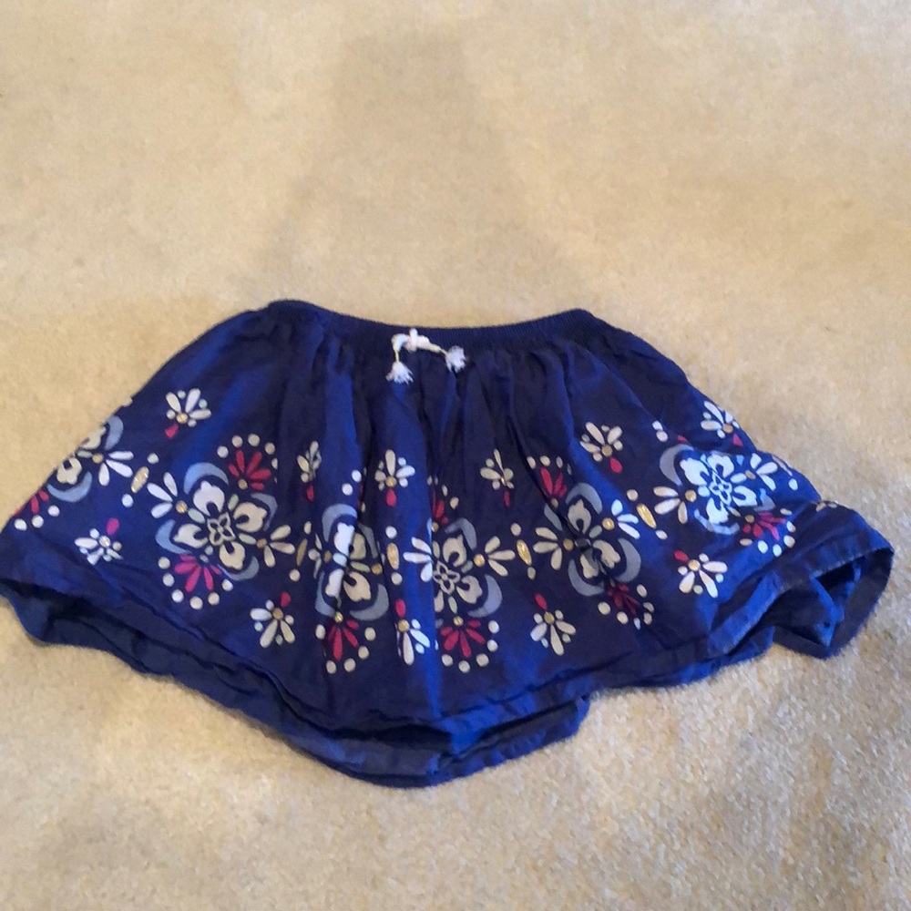 Girls Size 8 Blue Gymboree skirt with white, pink, and gold flowers